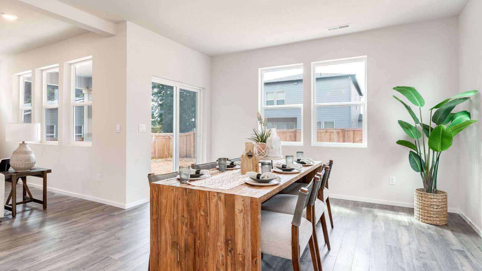 Dining area with a sliding glass door to a fenced backyard