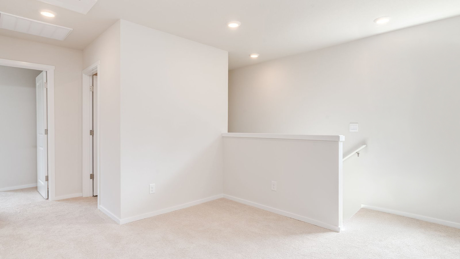 Hallway with wall-to-wall carpet