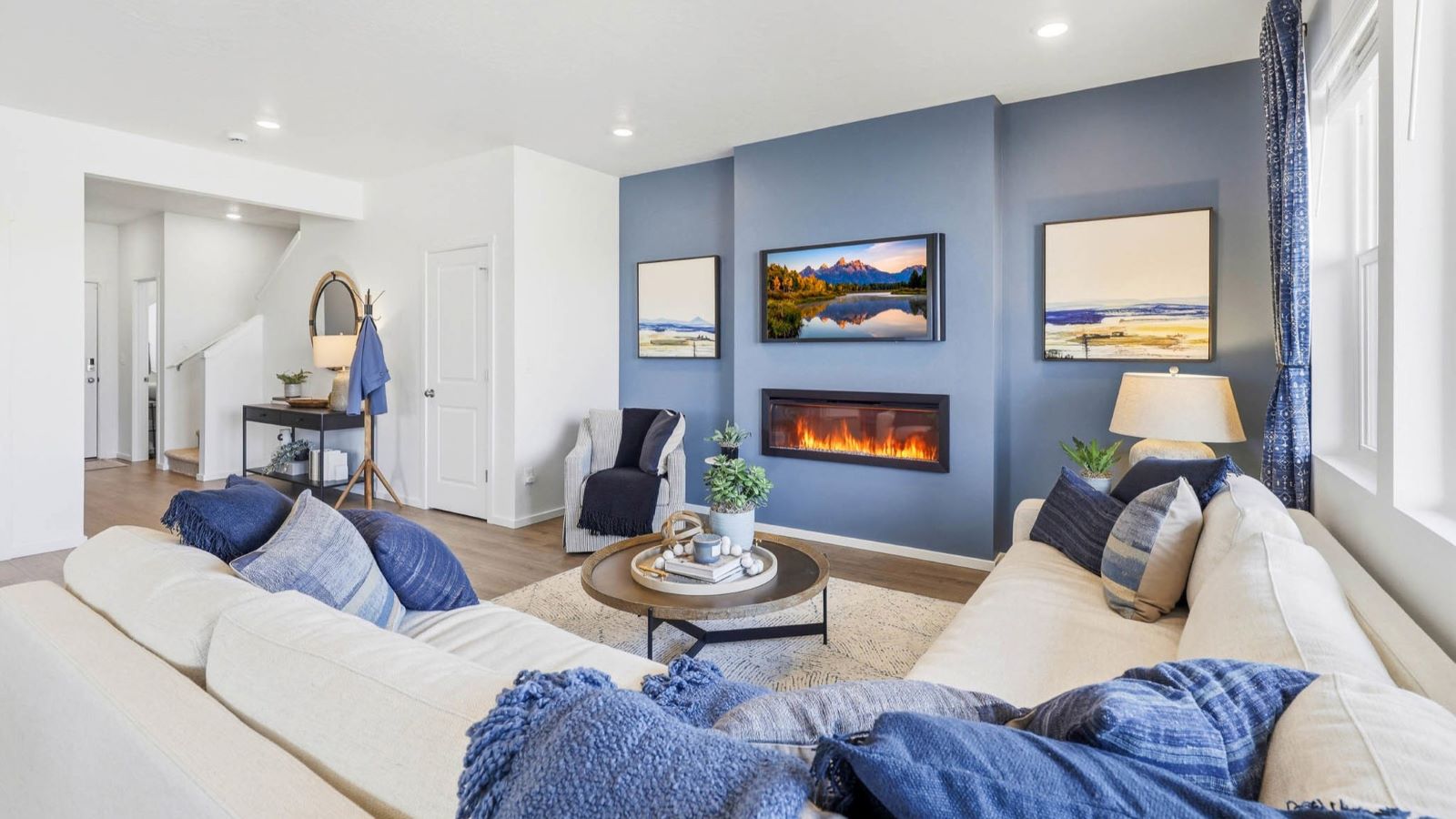 Great room with laminate flooring and an electric fireplace