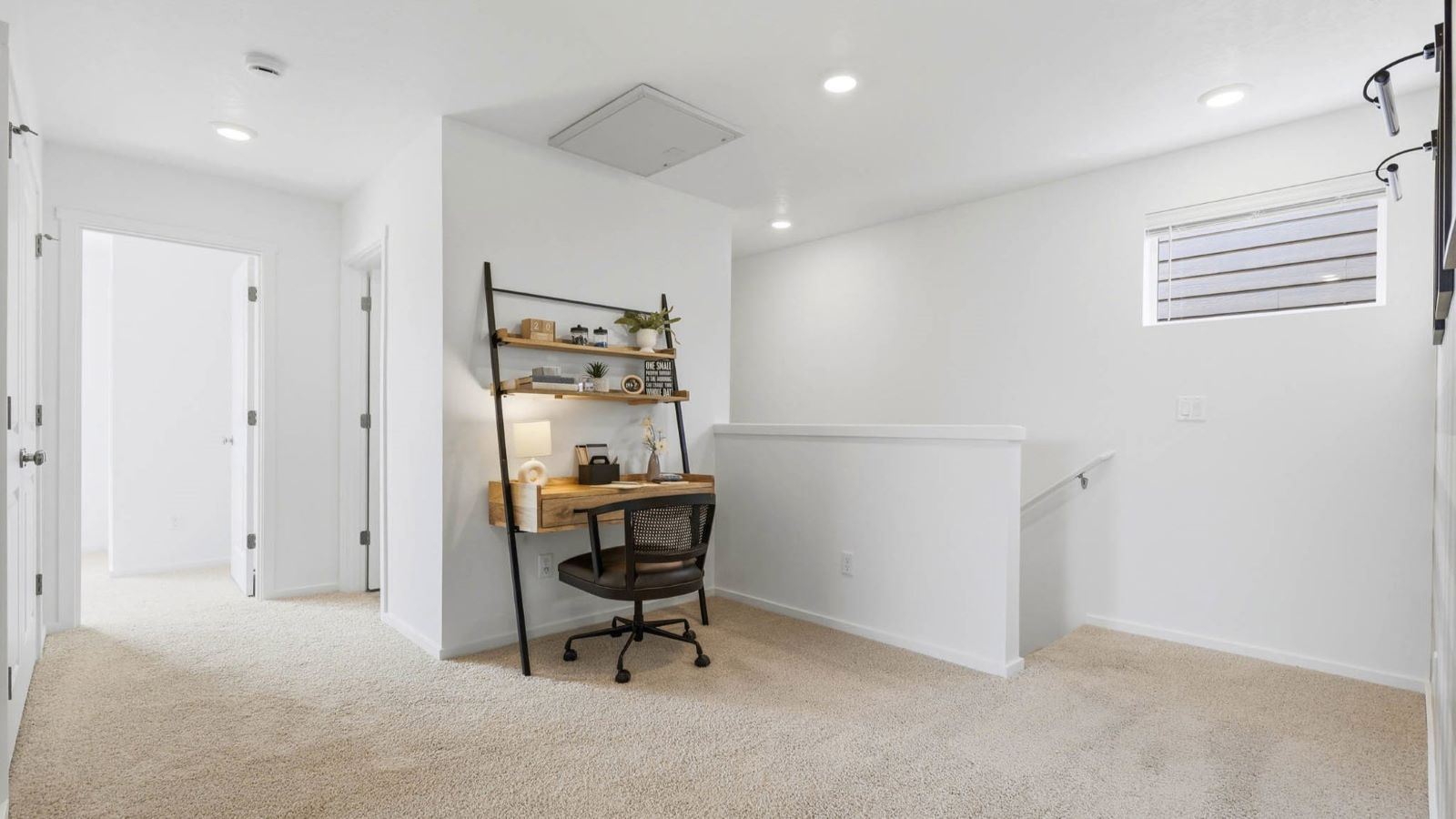 Hallway with wall-to-wall carpet