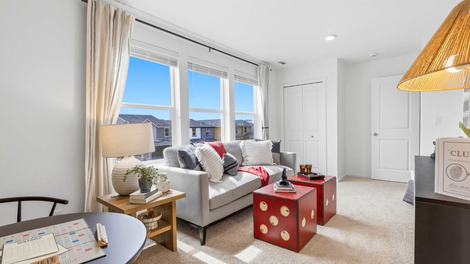 Bedroom with wall-to-wall carpet and a closet