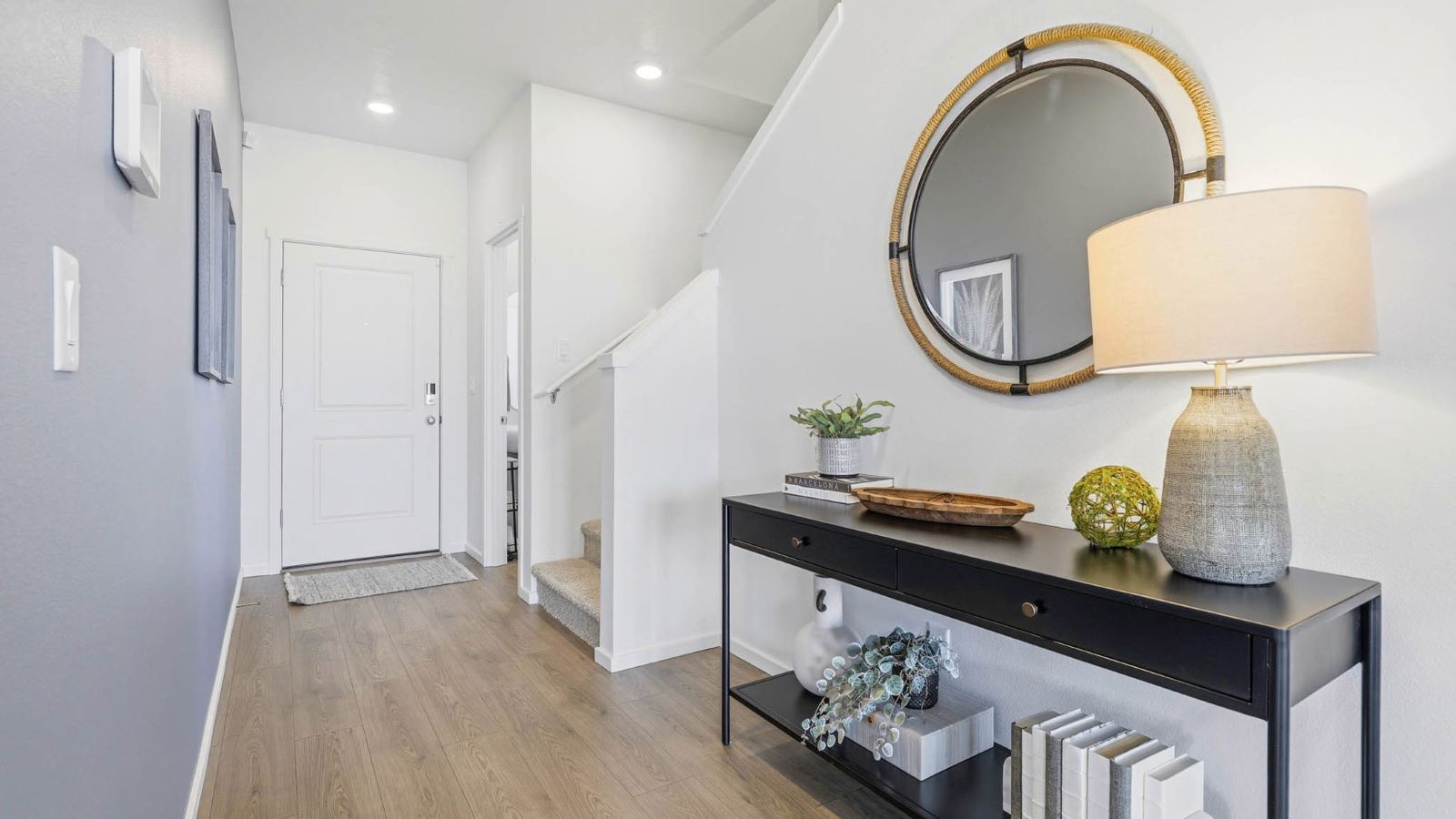 Entryway with a coat closet and laminate flooring