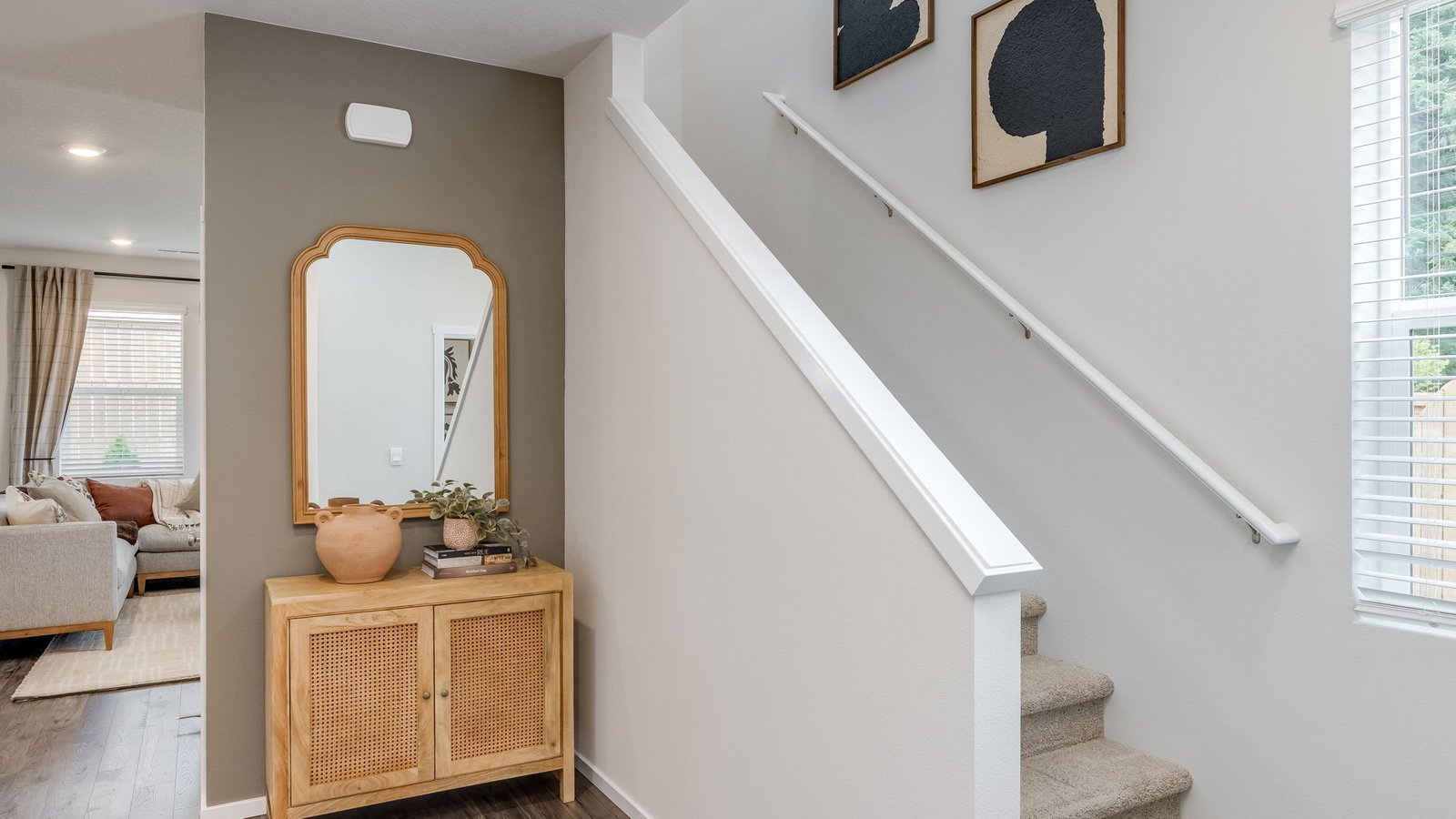 Entryway with a coat closet and laminate flooring