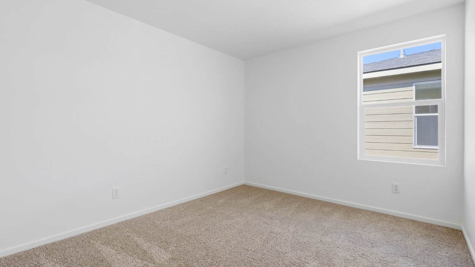 Bedroom with wall-to-wall carpet and a closet