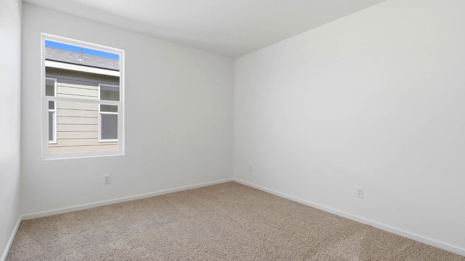 Bedroom with wall-to-wall carpet and a closet