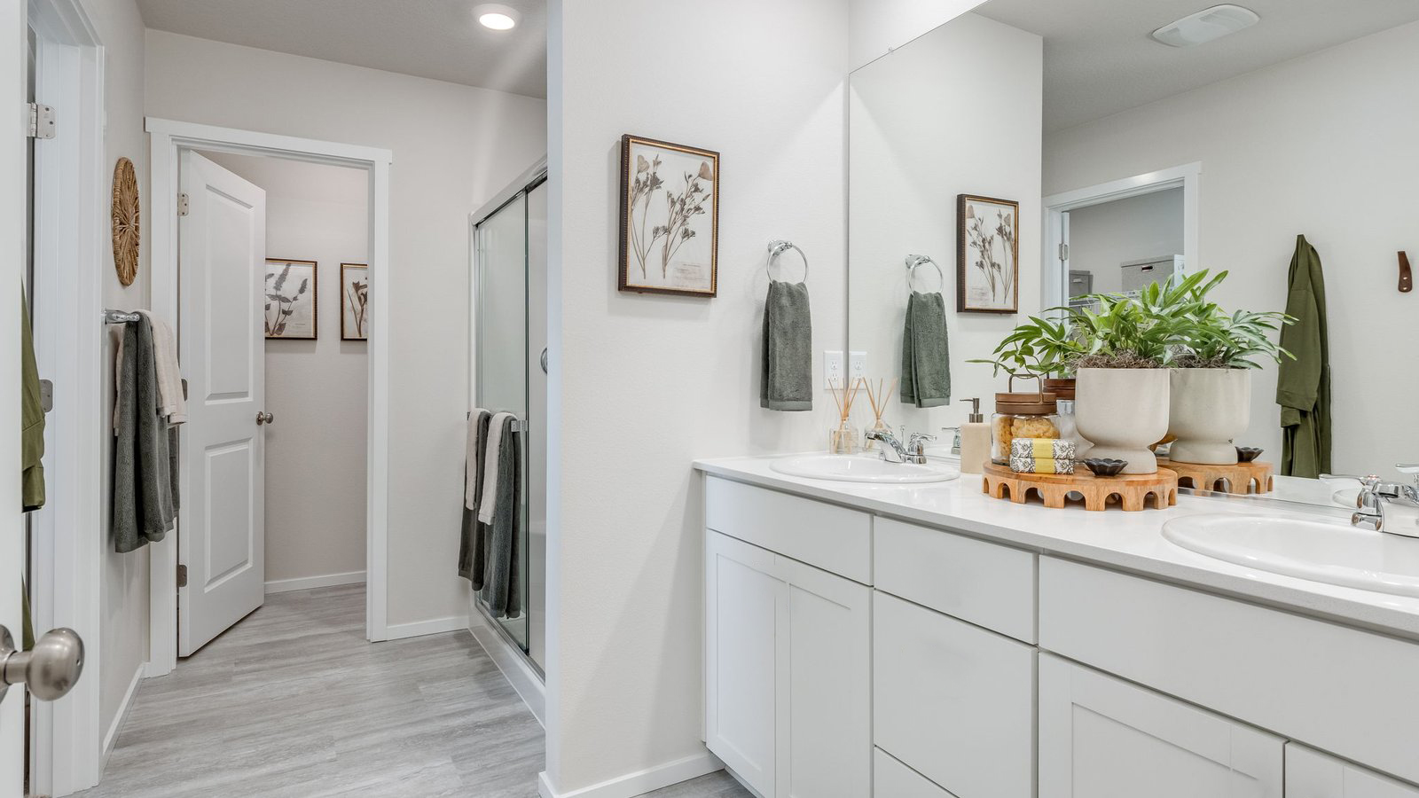 Primary bathroom with quartz counters and a walk-in shower