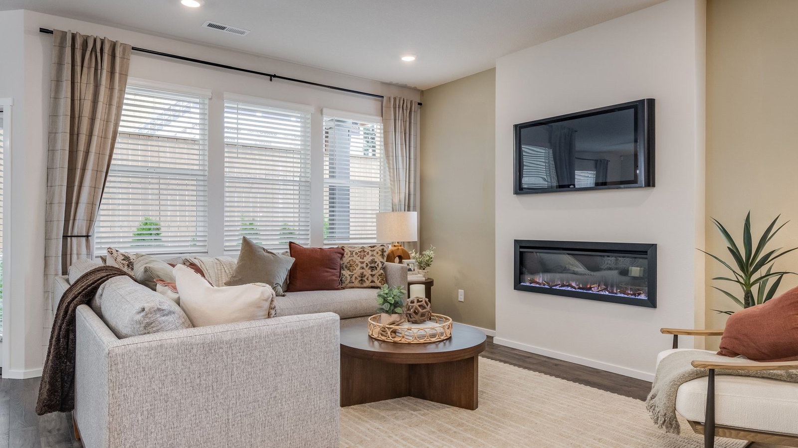 Great room with laminate flooring and an electric fireplace