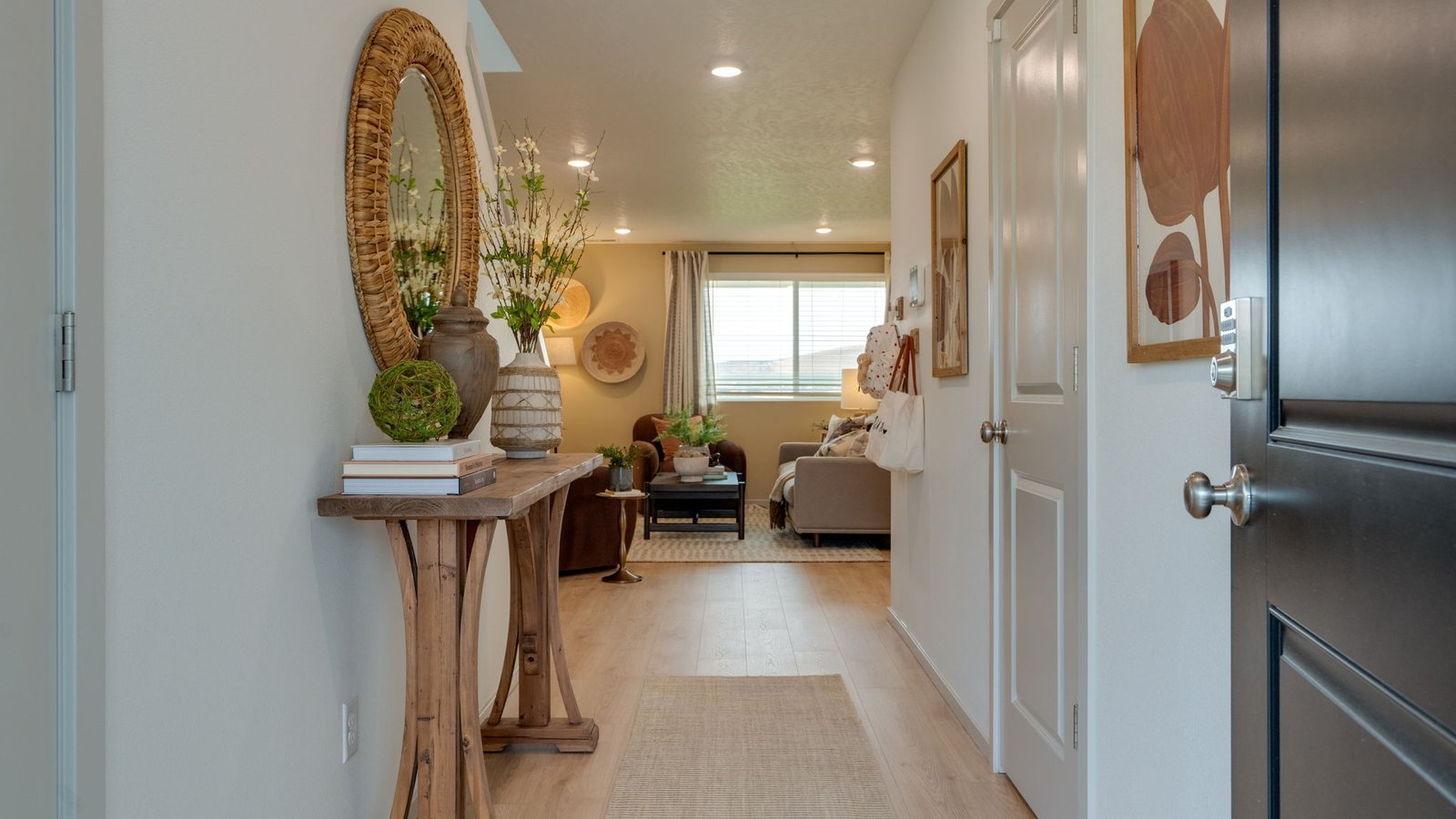 Entryway with a coat closet and laminate flooring