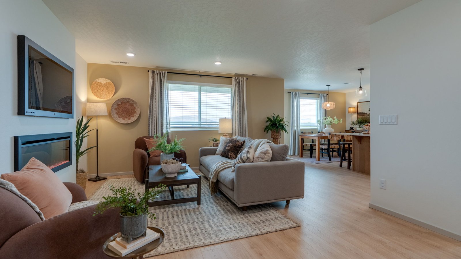 Great room with laminate flooring and an electric fireplace