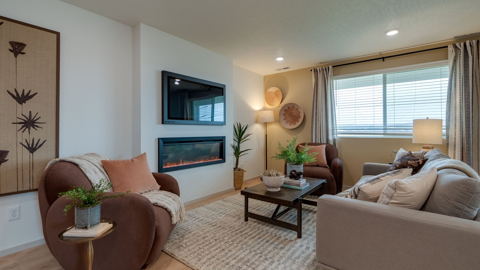 Great room with laminate flooring and an electric fireplace