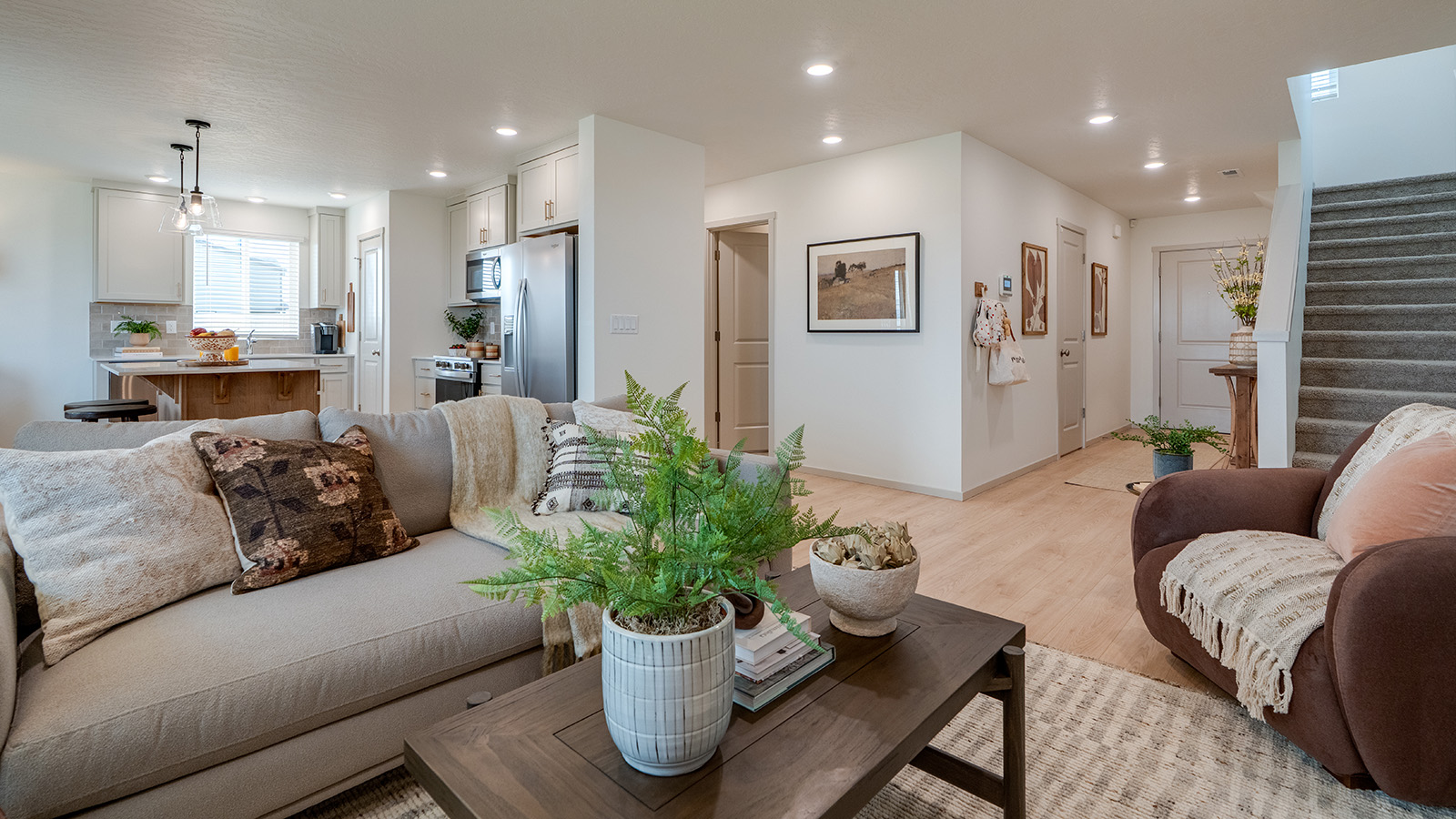 Great room with laminate flooring and an electric fireplace