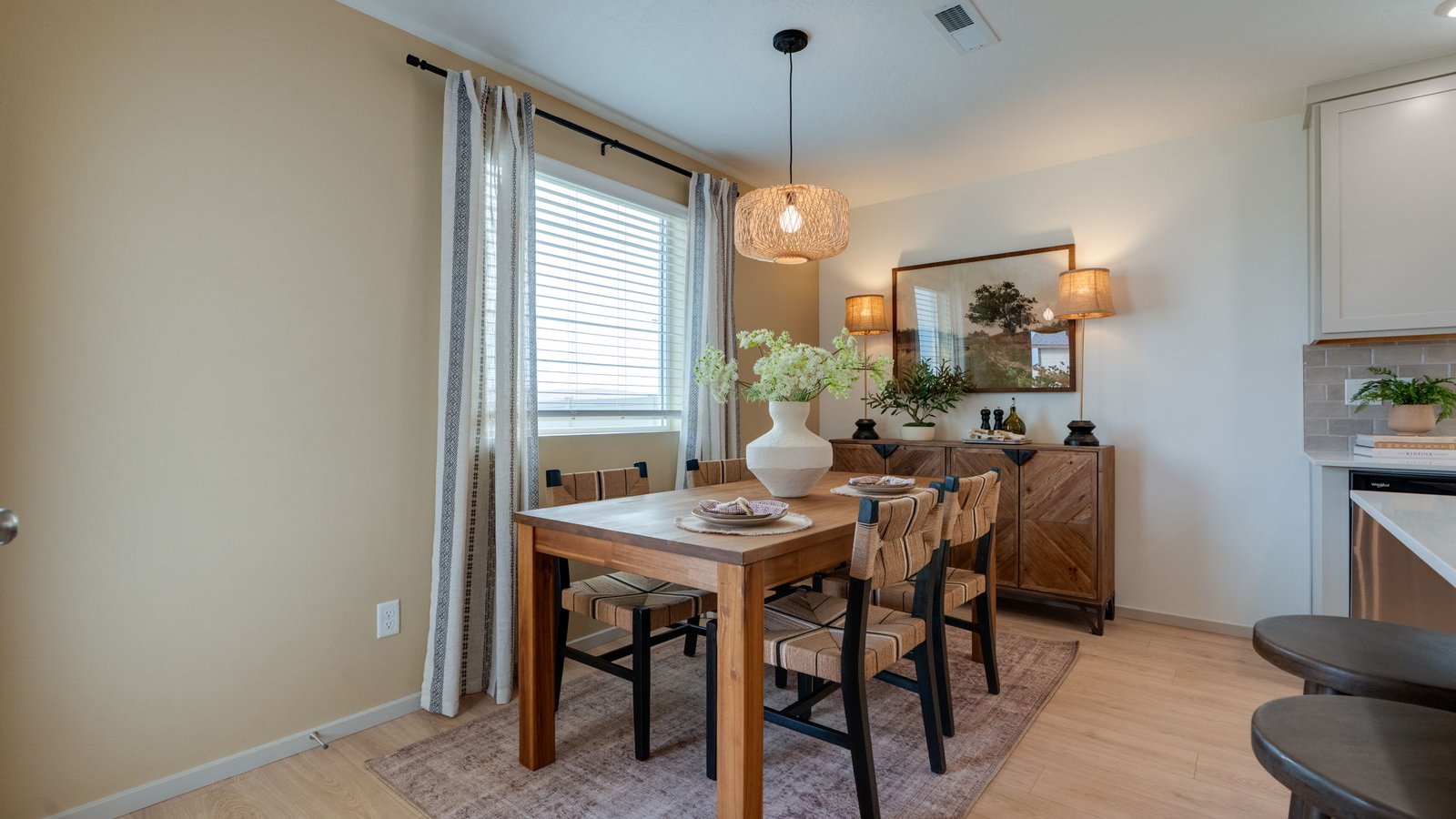Dining area with a sliding glass door to a fenced backyard