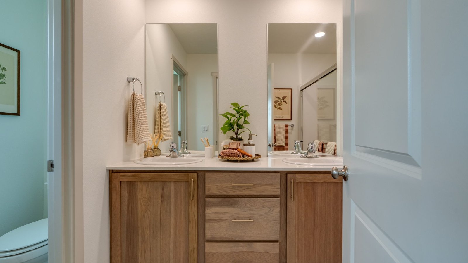 Primary bathroom with quartz counters and a walk-in shower