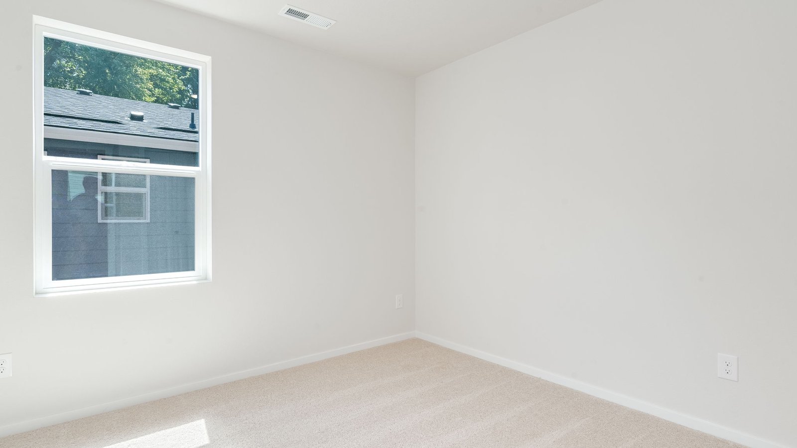 Bedroom with wall-to-wall carpet and a closet