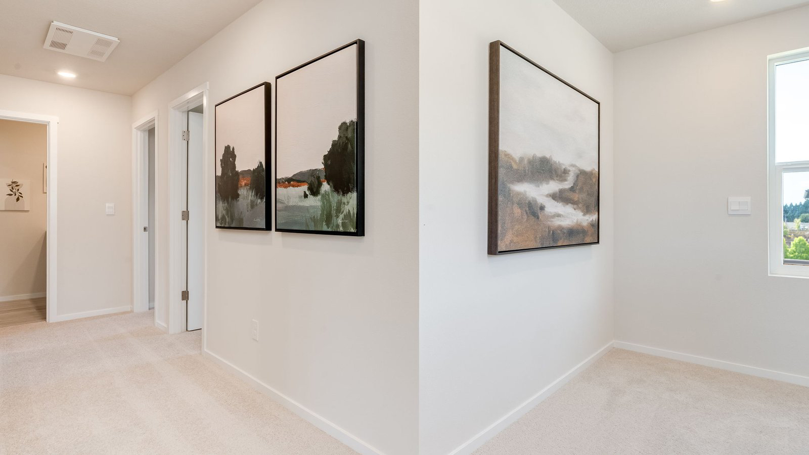 Hallway with wall-to-wall carpet
