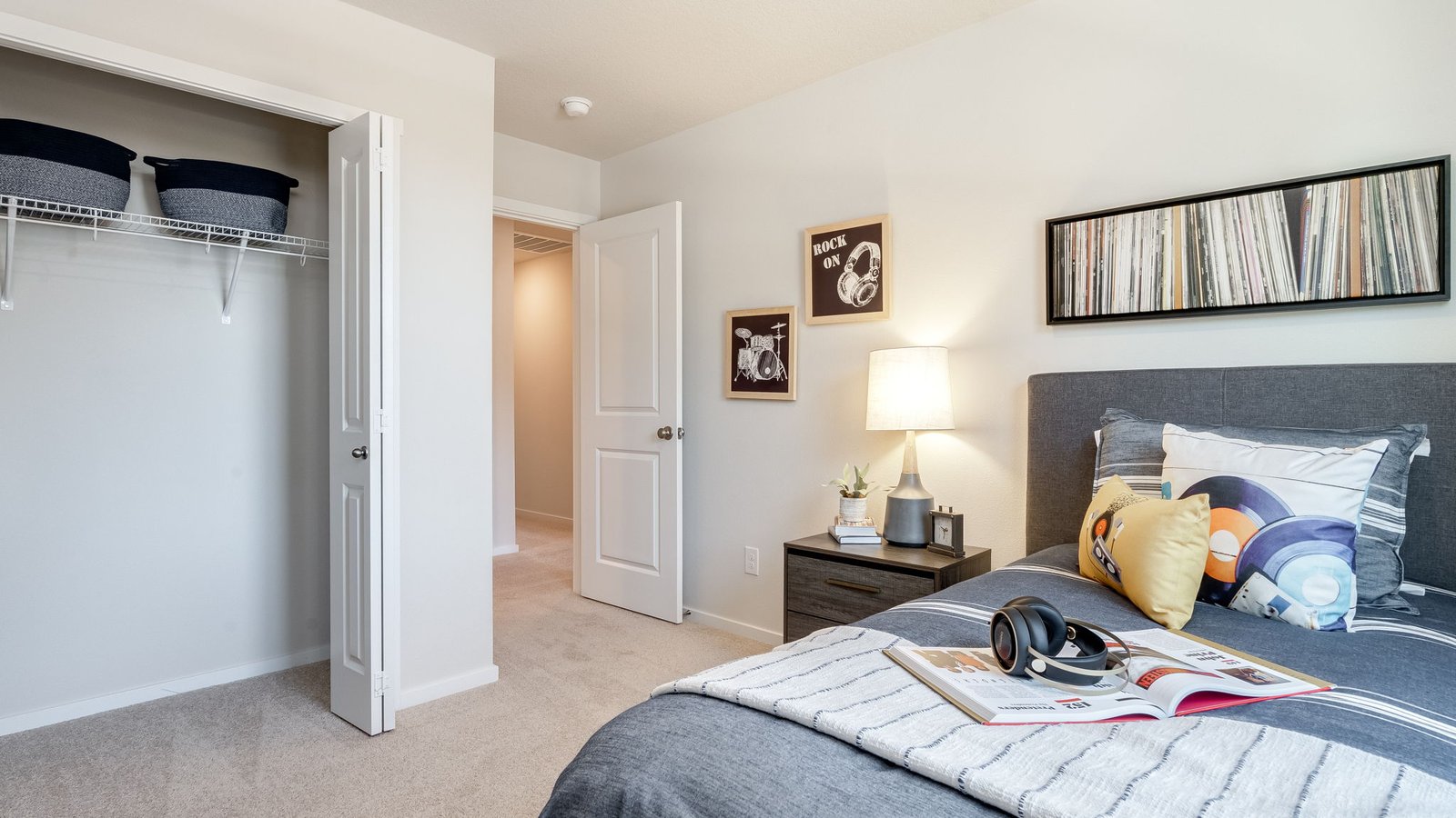 Bedroom with wall-to-wall carpet and a closet