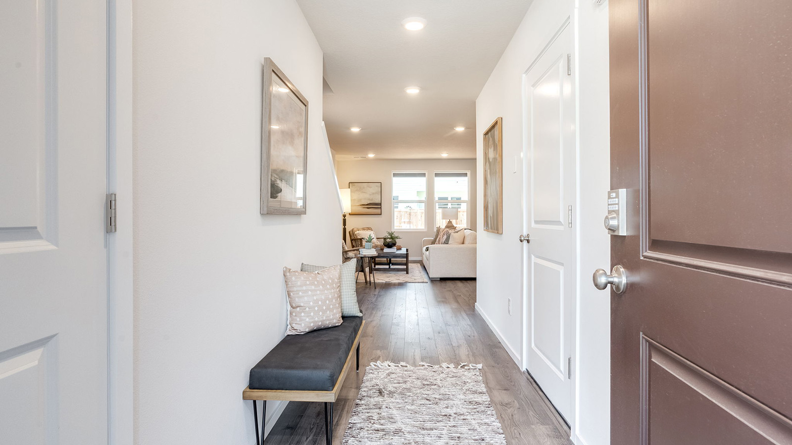 Entryway with a coat closet and laminate flooring