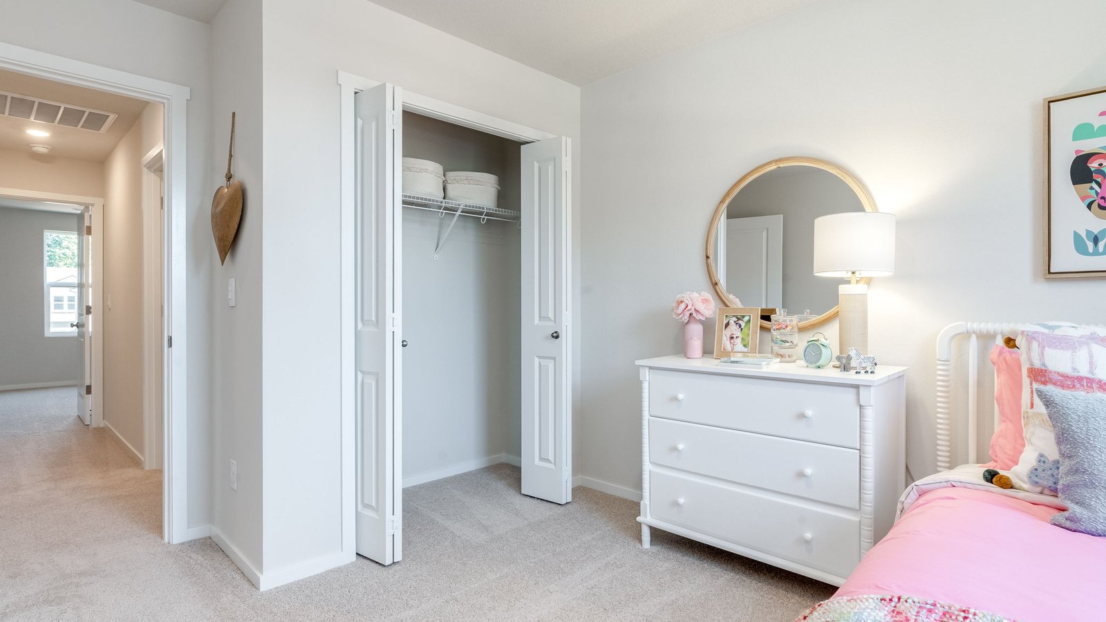 Bedroom with wall-to-wall carpet and a closet