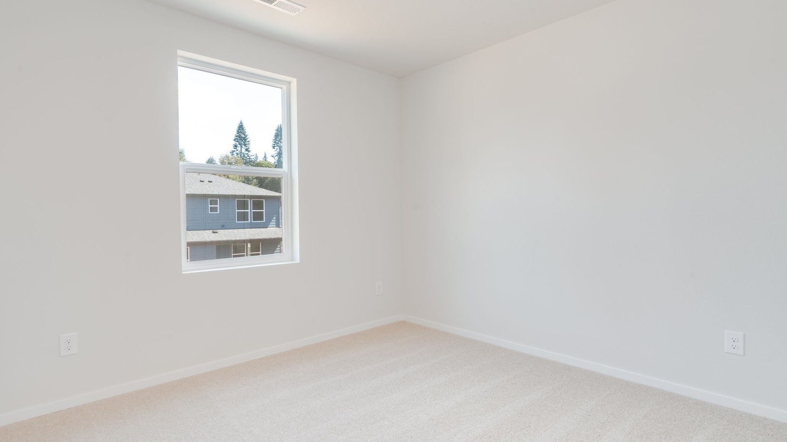 Bedroom with wall-to-wall carpet and a closet