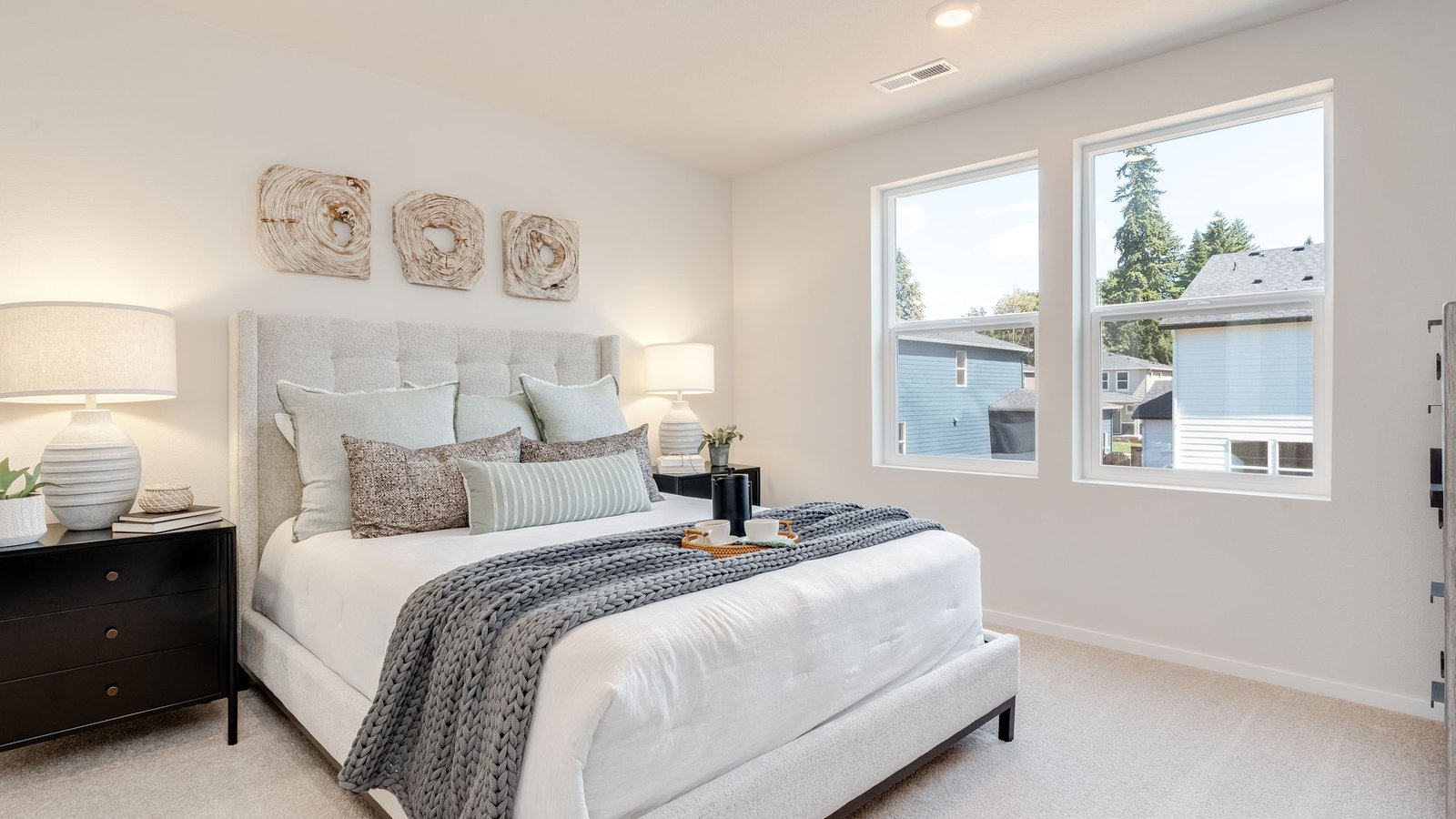 Primary bedroom with wall-to-wall carpet, a walk-in closet and an attached bathroom