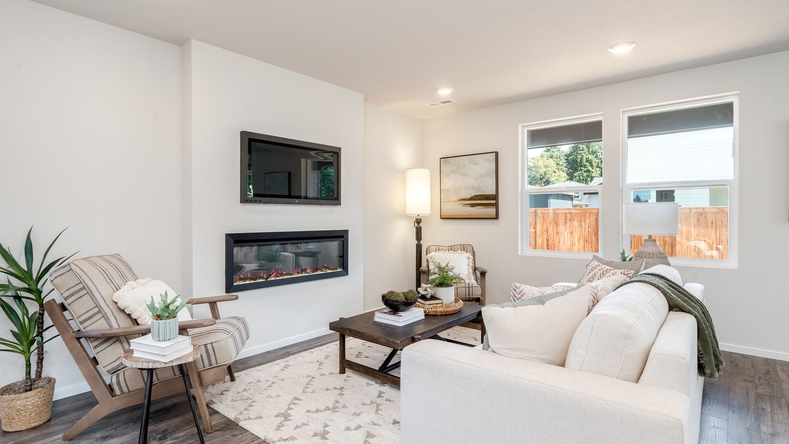 Great room with laminate flooring and an electric fireplace