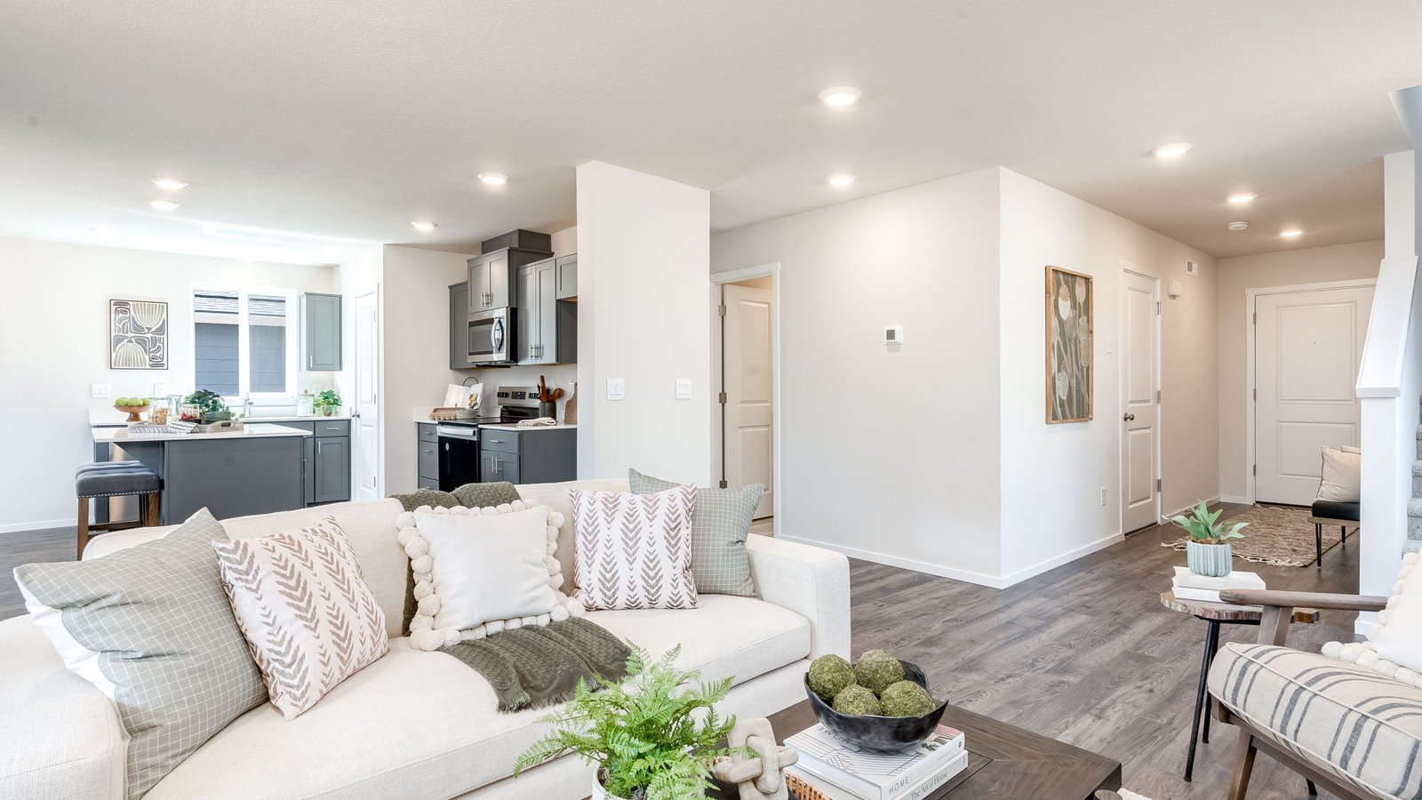 Great room with laminate flooring and an electric fireplace