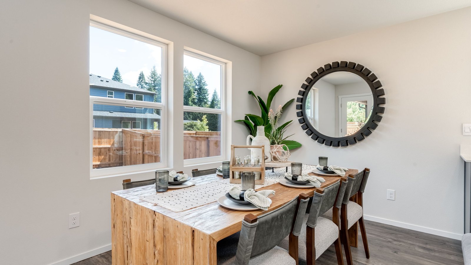 Dining area with a sliding glass door to a fenced backyard