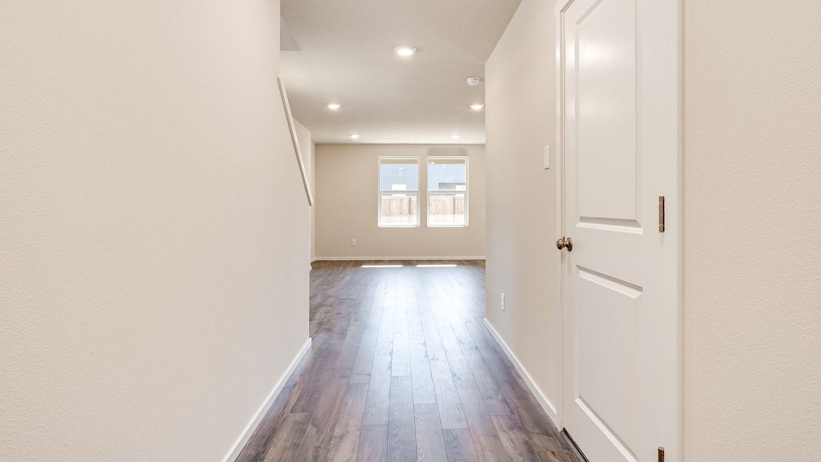 Entryway with a coat closet and laminate flooring