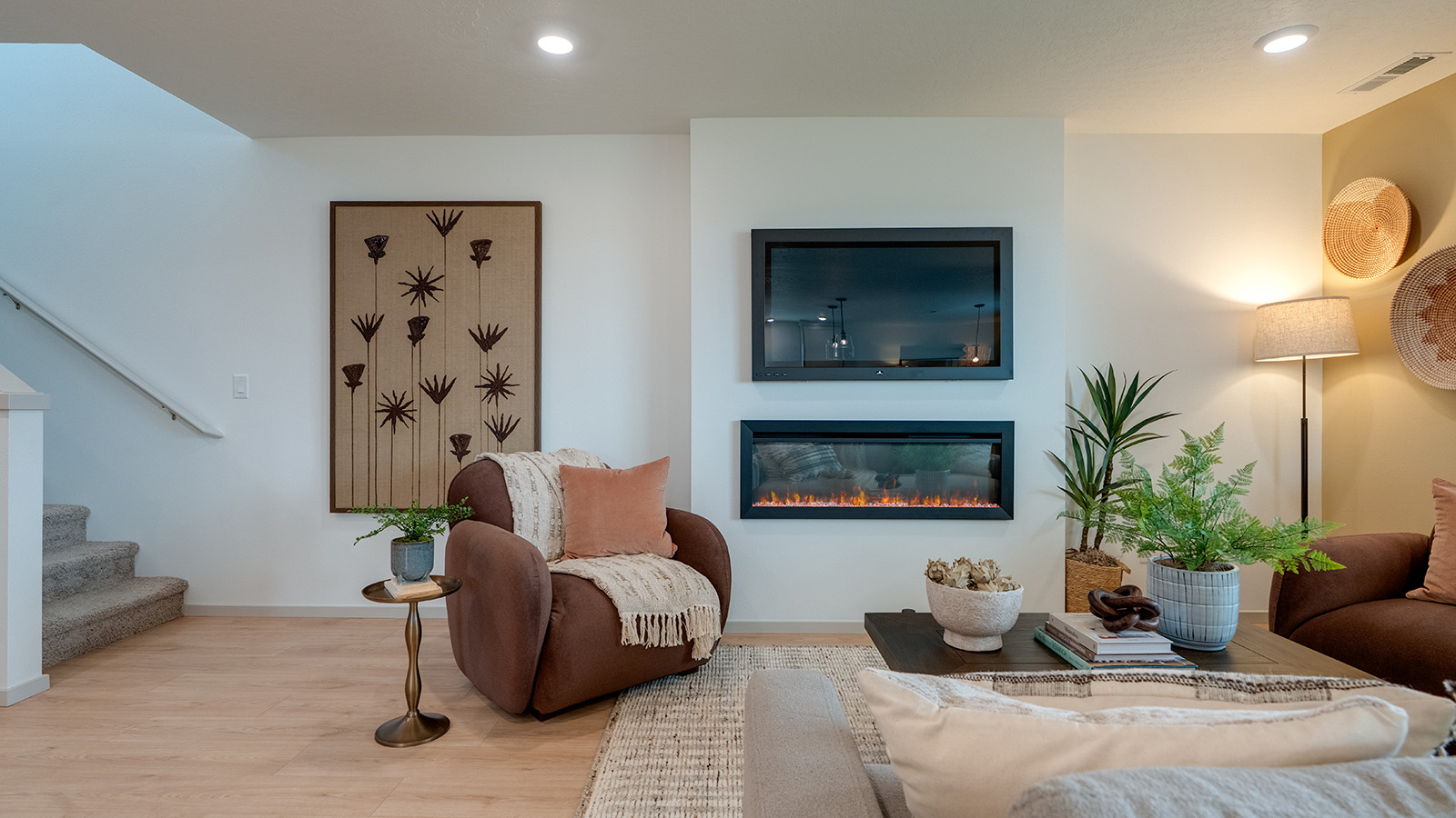 Great room with laminate flooring and an electric fireplace
