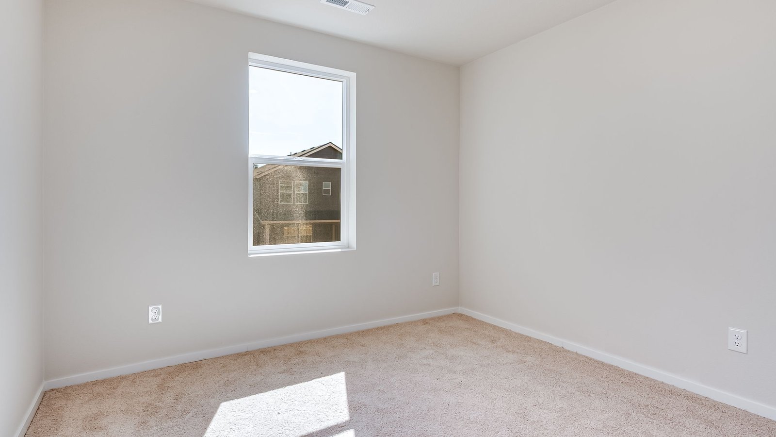 Bedroom with wall-to-wall carpet and a closet