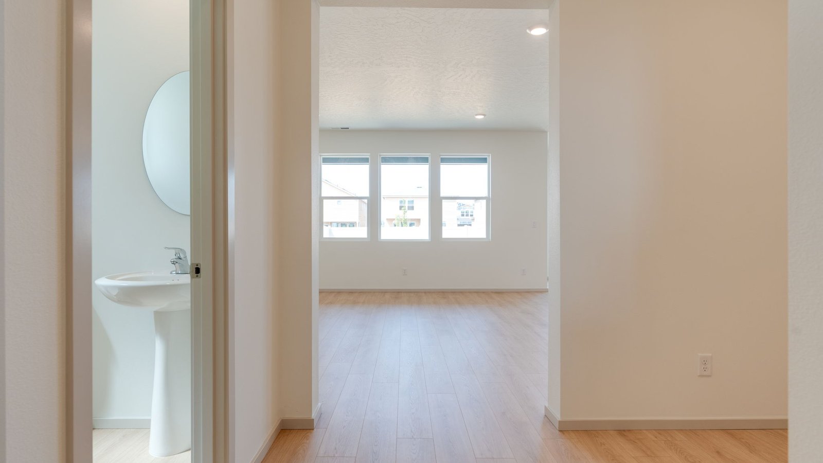 Entryway with a coat closet and laminate flooring
