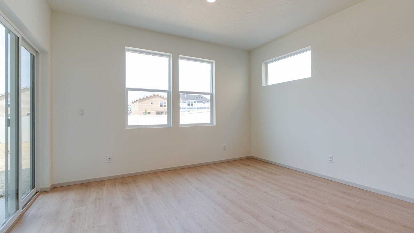 Dining area with a sliding glass door to a fenced backyard