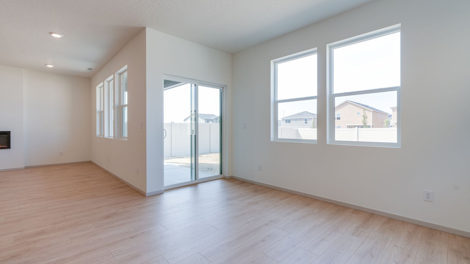 Dining area with a sliding glass door to a fenced backyard