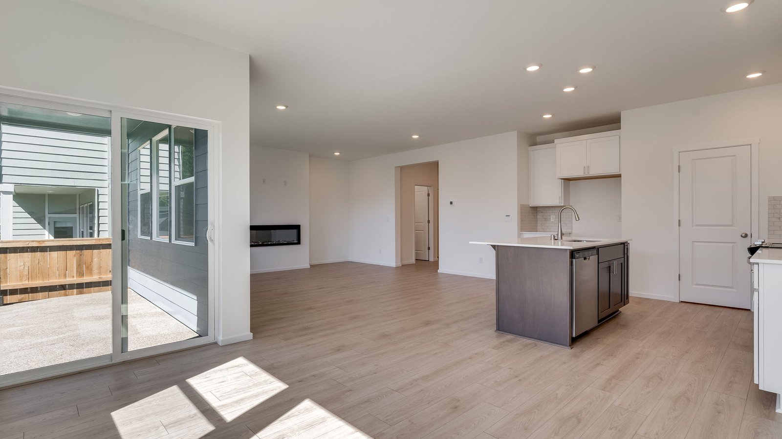 Dining area with a sliding glass door to a fenced backyard
