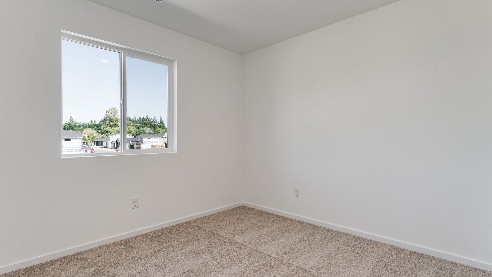 Bedroom with wall-to-wall carpet and a closet