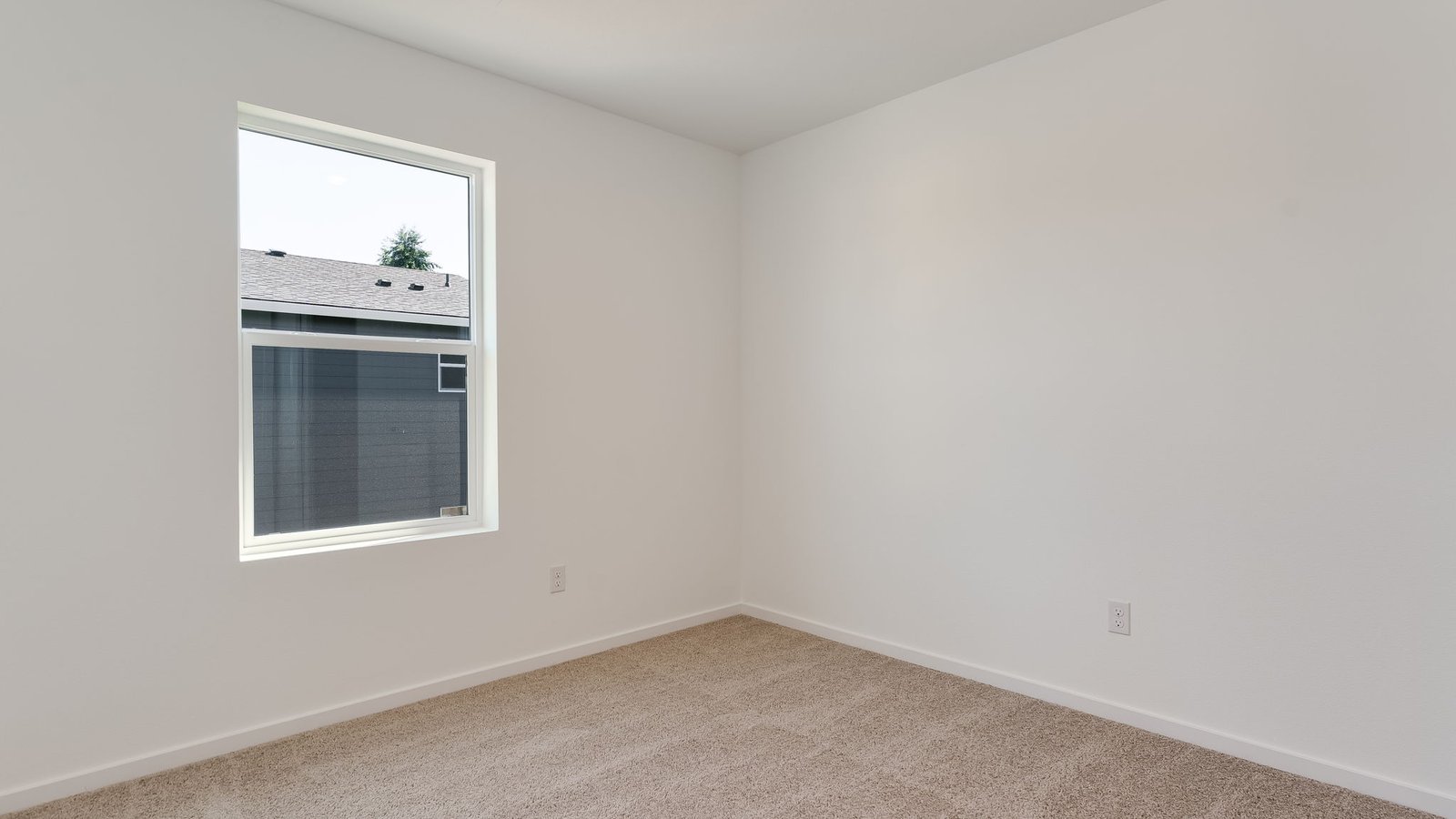 Bedroom with wall-to-wall carpet and a closet