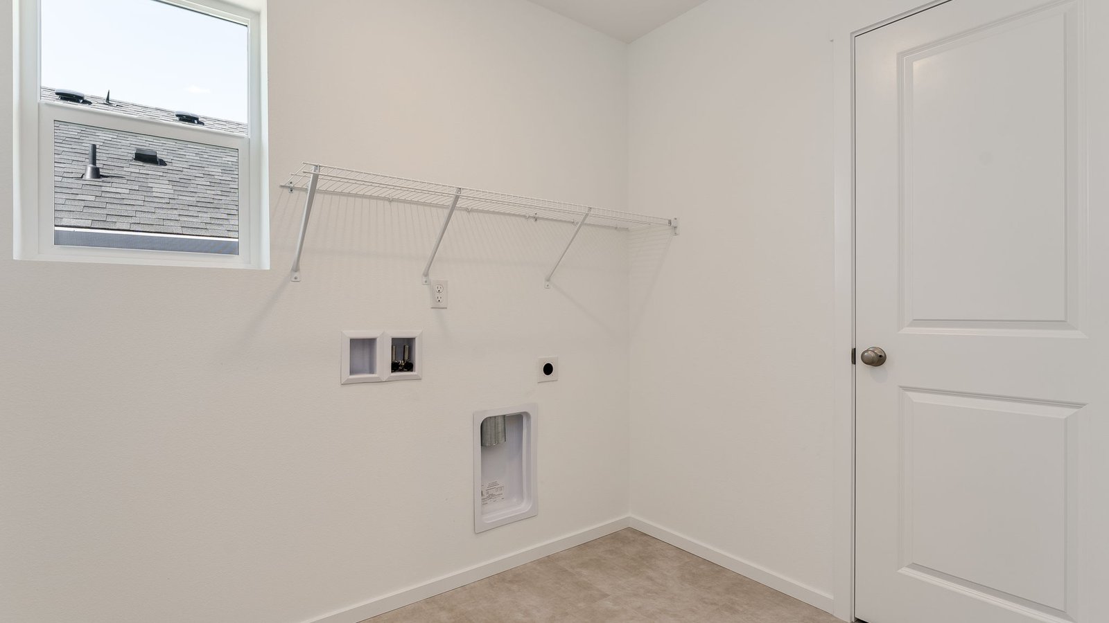 Laundry room with wire shelves and washer and dryer hookups
