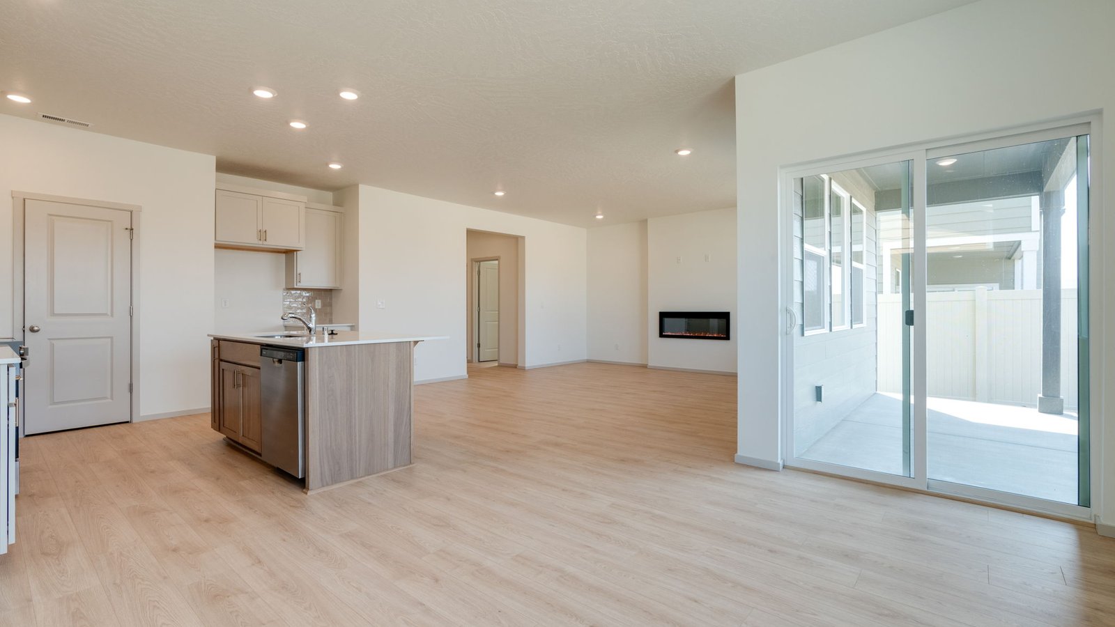 Dining area with a sliding glass door to a fenced backyard