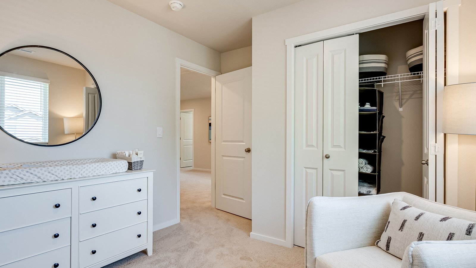 Bedroom with wall-to-wall carpet and a closet