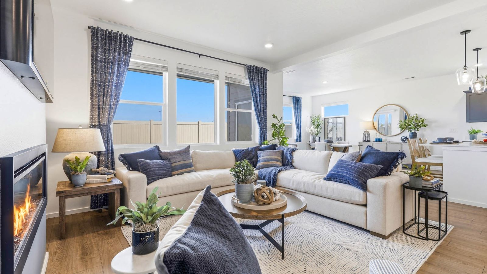 Great room with laminate flooring and an electric fireplace