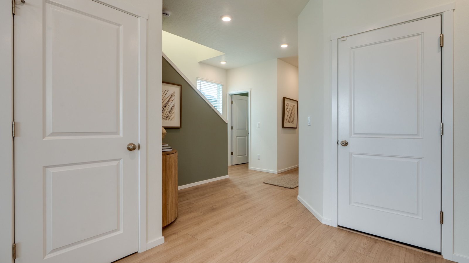 Hallway with wall-to-wall carpet