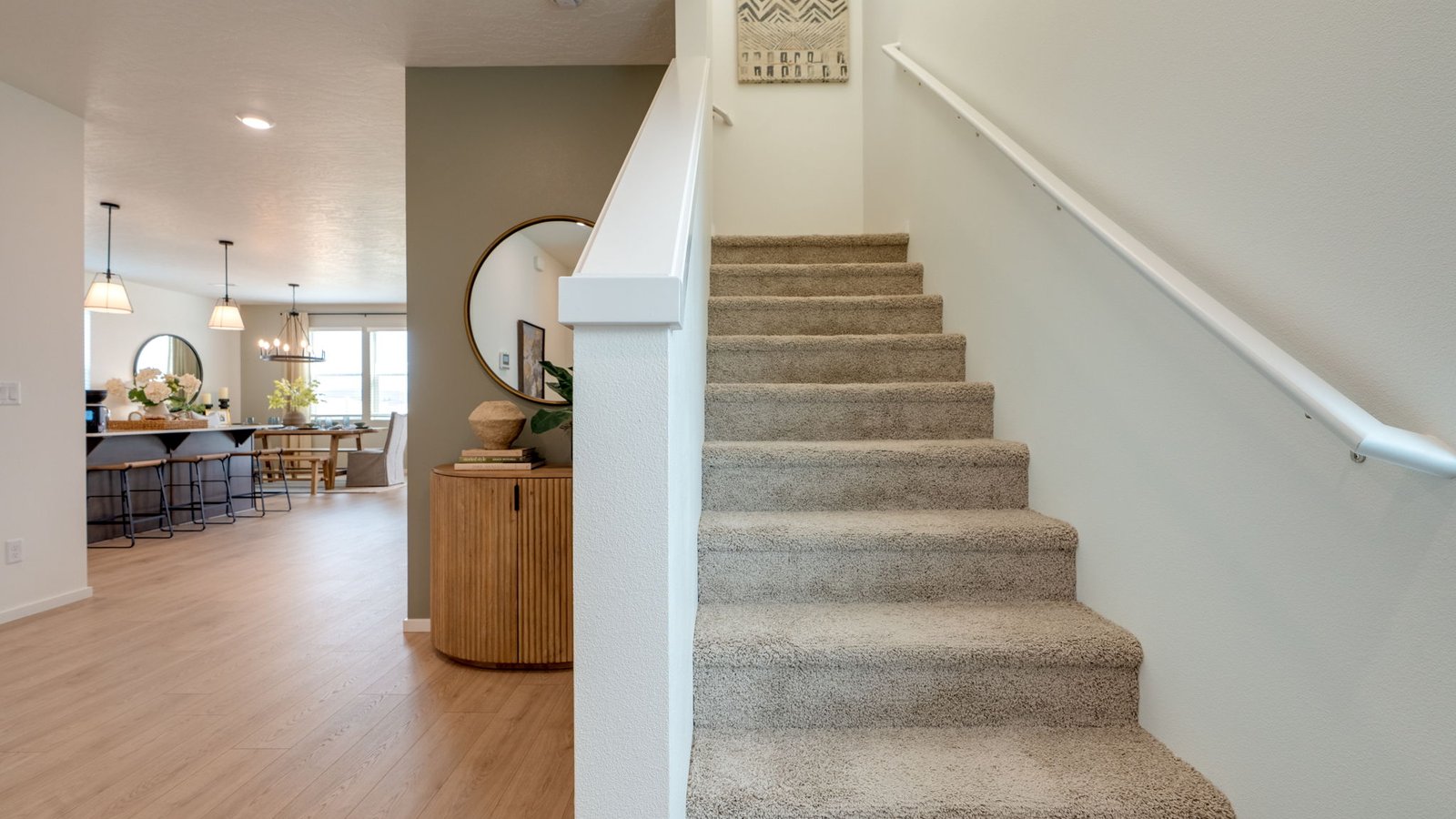 Entryway with a coat closet and laminate flooring