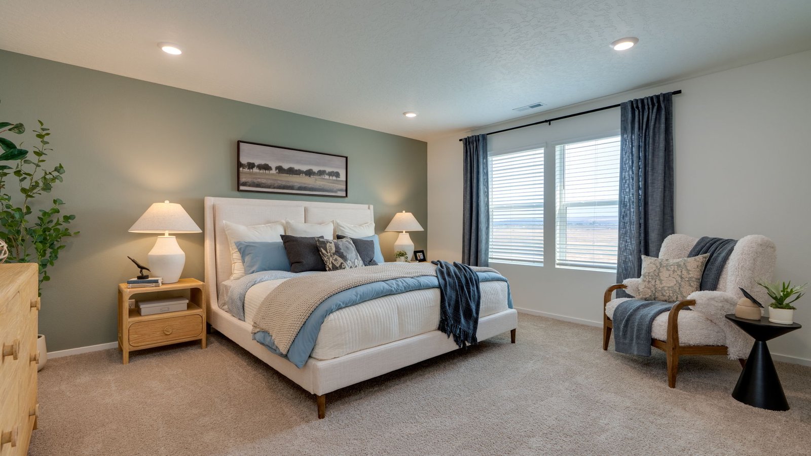 Primary bedroom with wall-to-wall carpet, a walk-in closet and an attached bathroom