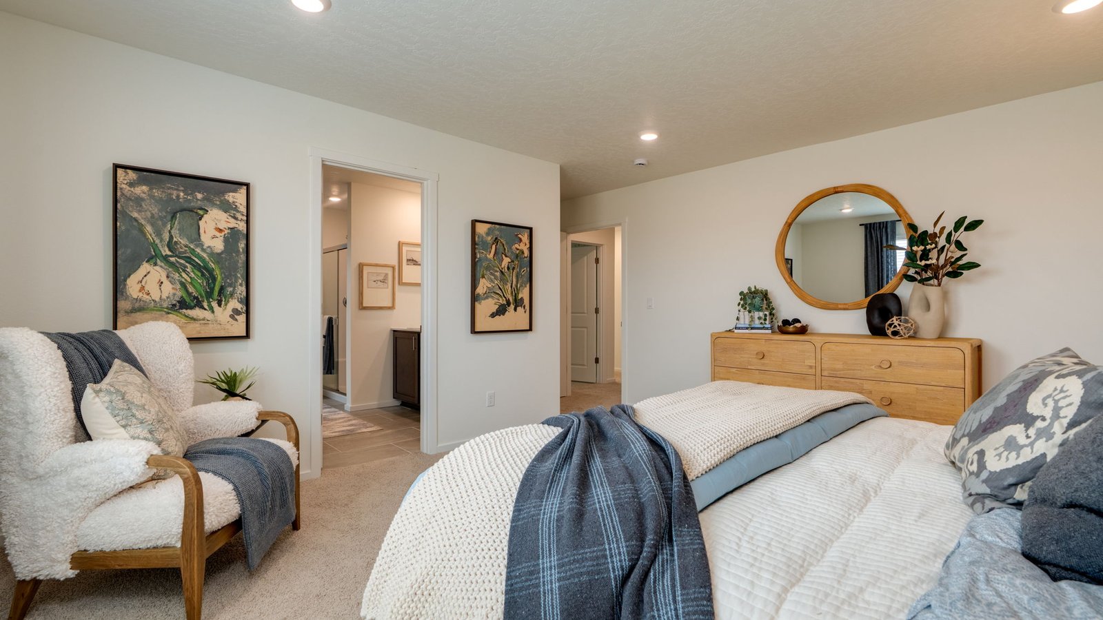 Primary bedroom with wall-to-wall carpet, a walk-in closet and an attached bathroom