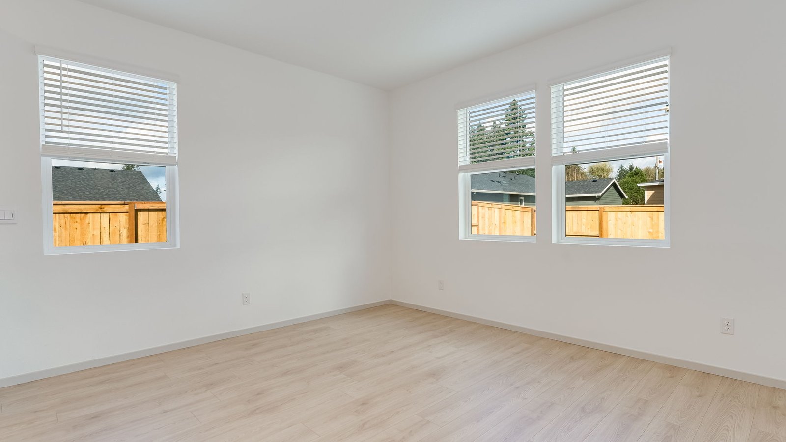 Dining area with a sliding glass door to a fenced backyard