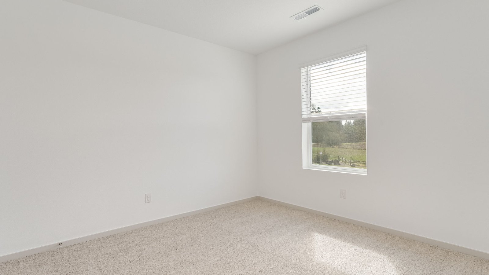 Bedroom with wall-to-wall carpet and a closet