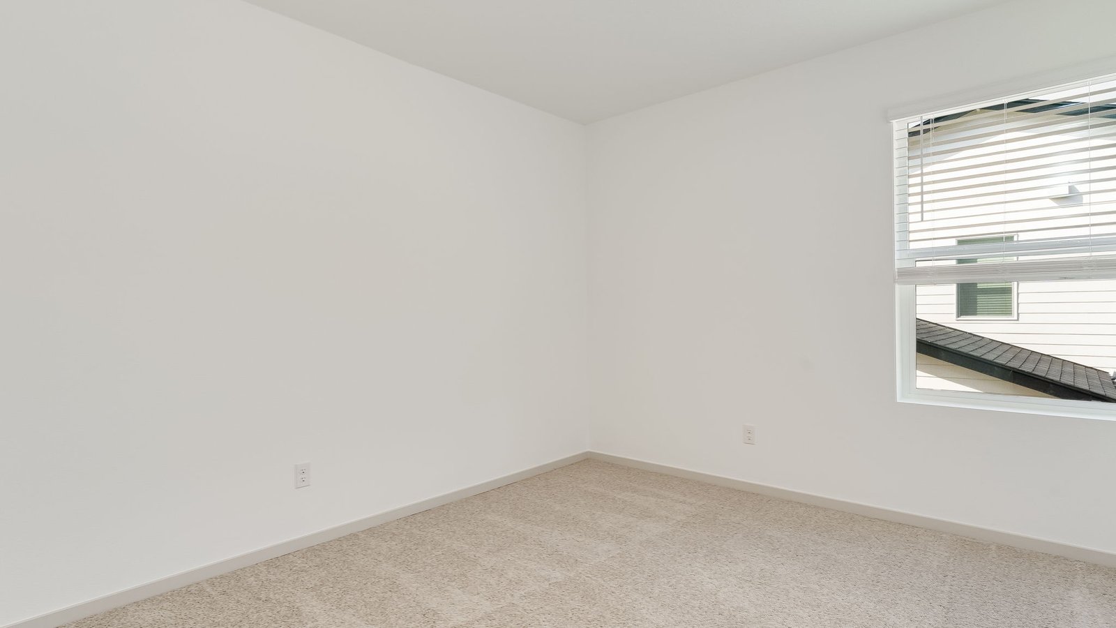 Bedroom with wall-to-wall carpet and a closet