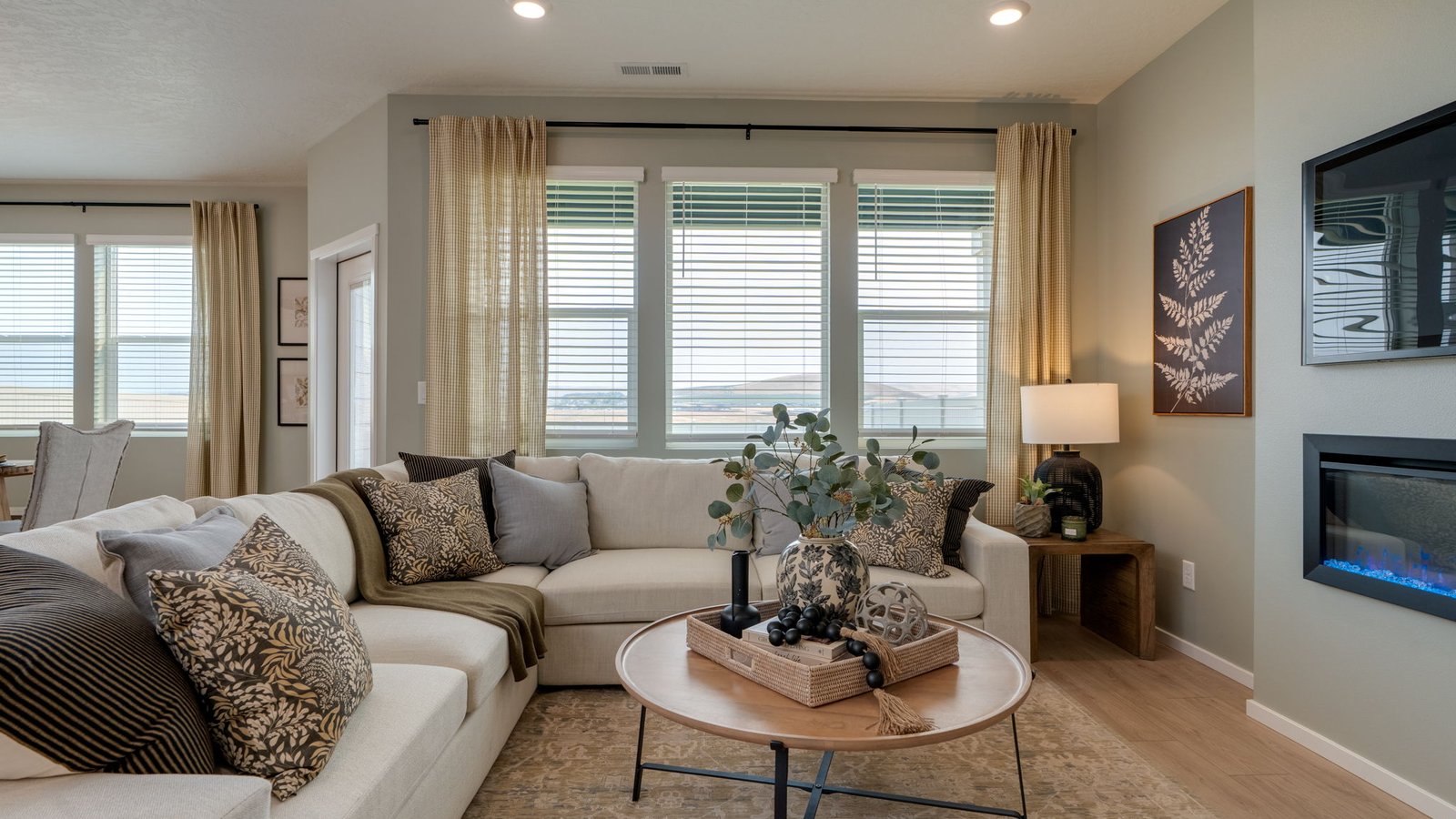 Great room with laminate flooring and an electric fireplace