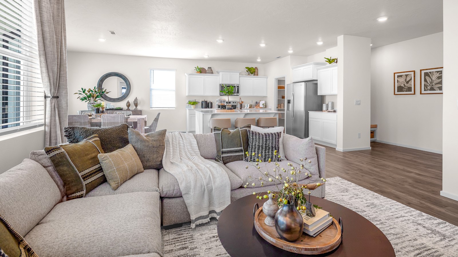 Great room with laminate flooring and an electric fireplace