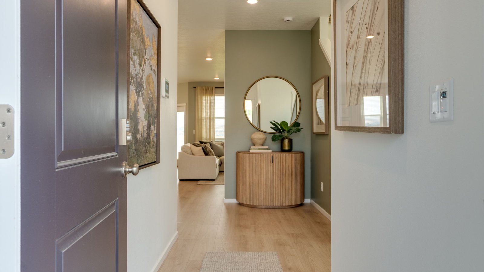 Entryway with a coat closet and laminate flooring